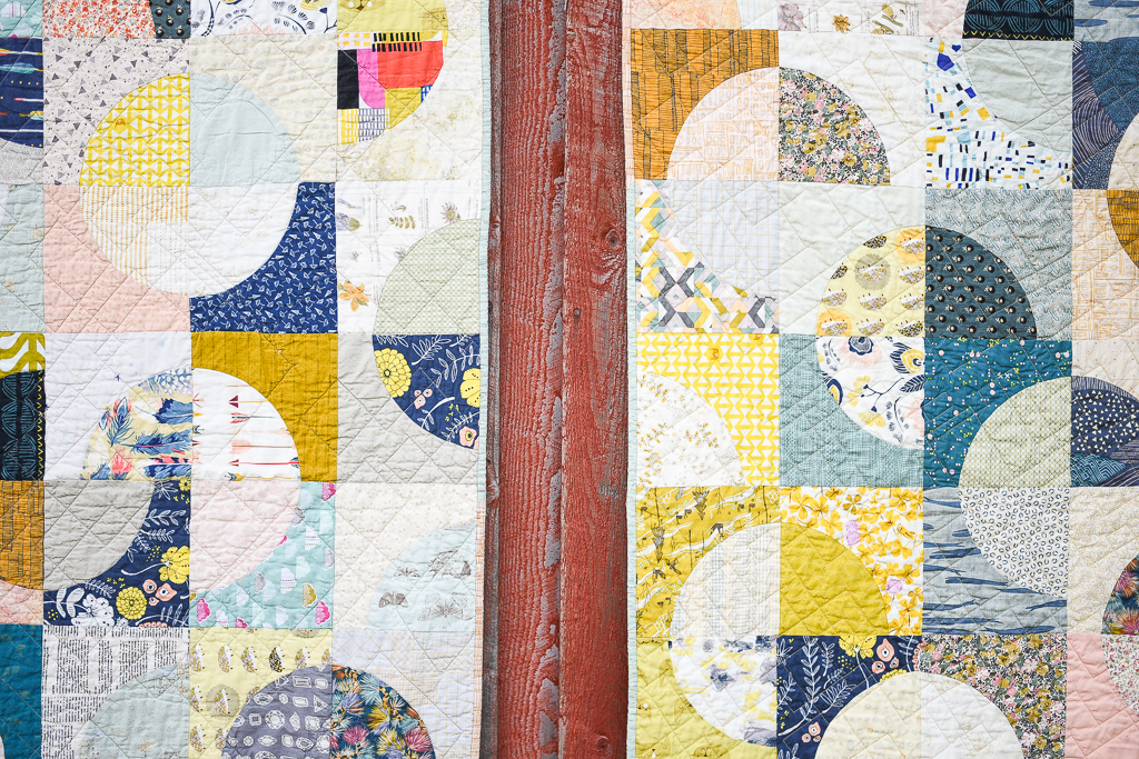 Detail of Double Time Quilts on red barn